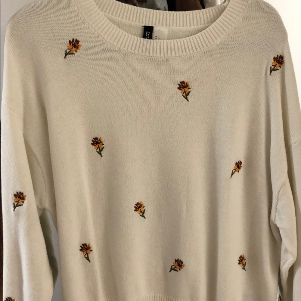 White sweater with embroidered flowers
